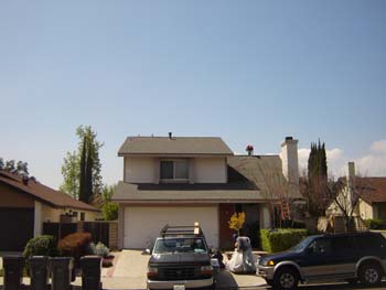 House With Cars in Driveway